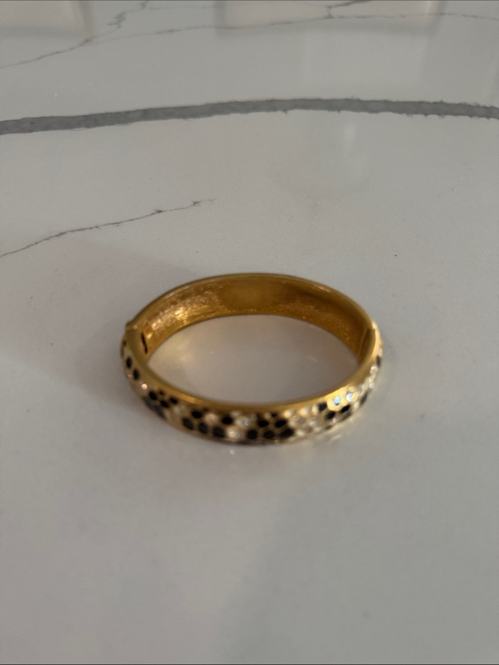 Guess Gold Tone Women's Hinged Bangle Bracelet with Black Accent Spots